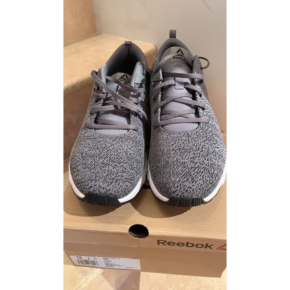REEBOK.‎ NWOT. Print Lux.Grey/White/Black running Sneakers. Rubber soles. W/Box.